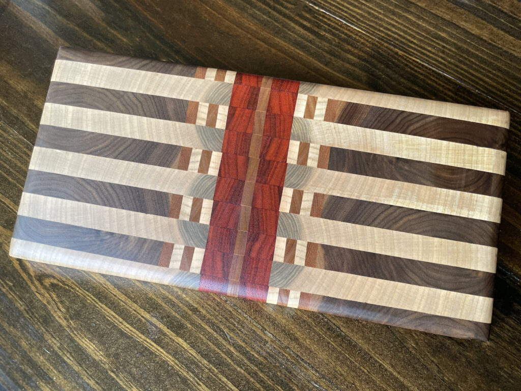 walnut, maple, mahogany and padauk wood cutting board